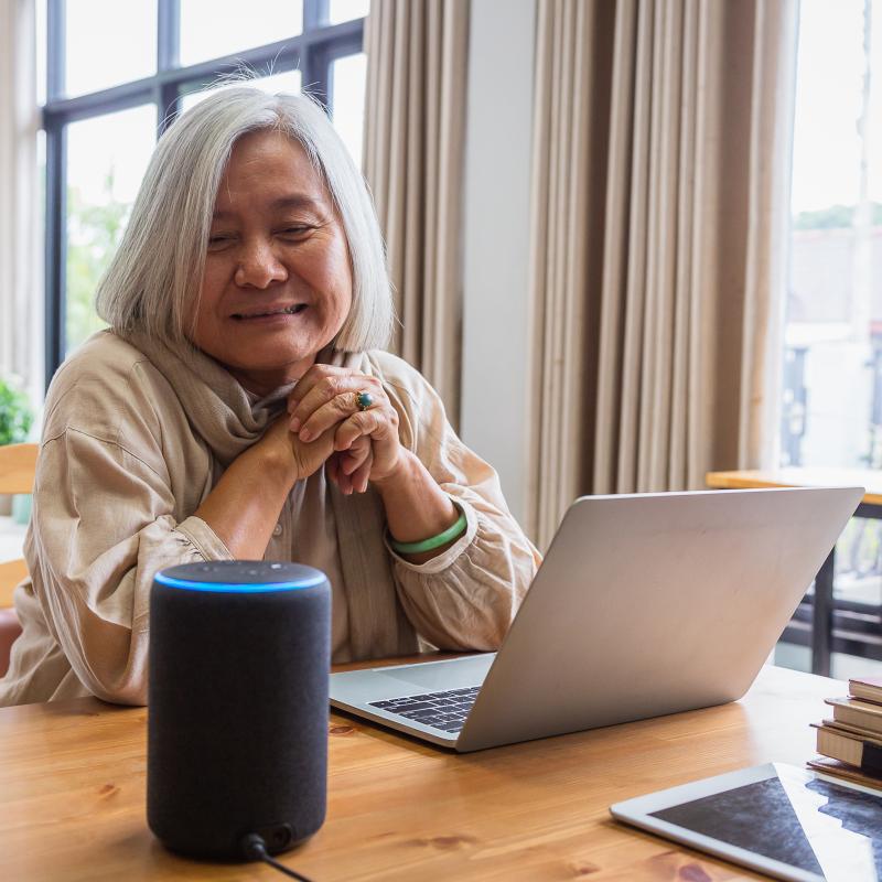 Elder Using Alexa and Laptop